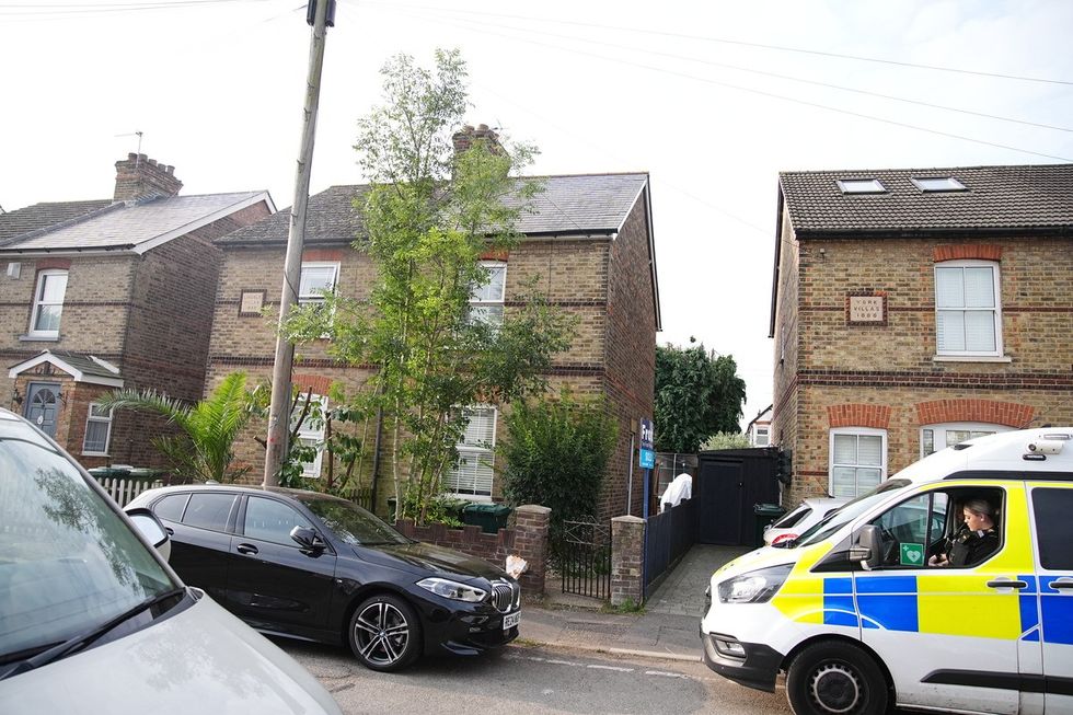 Police in Bremer Road, Staines-Upon-Thames near a property where three children and a man were found dead