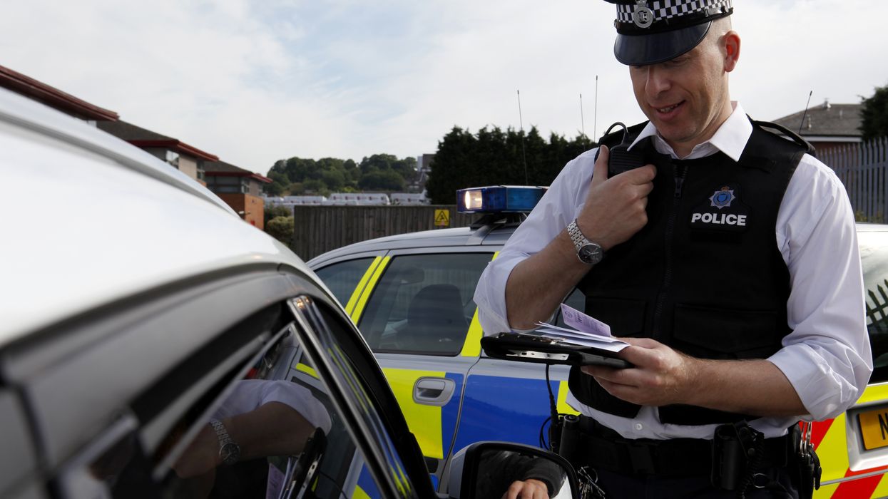 Police issuing a driver a fine