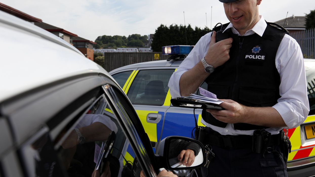 Police issuing a driver a fine