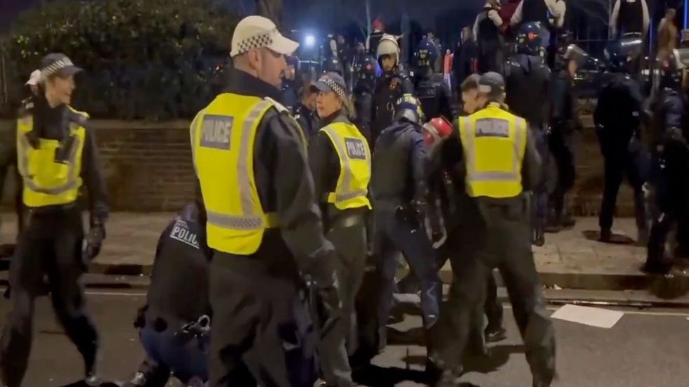 Police make arrests outside the Iran embassy in London