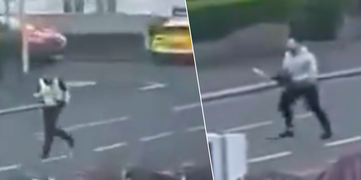 NextImg:Police swarm street after man spotted chasing officer with CHAINSAW