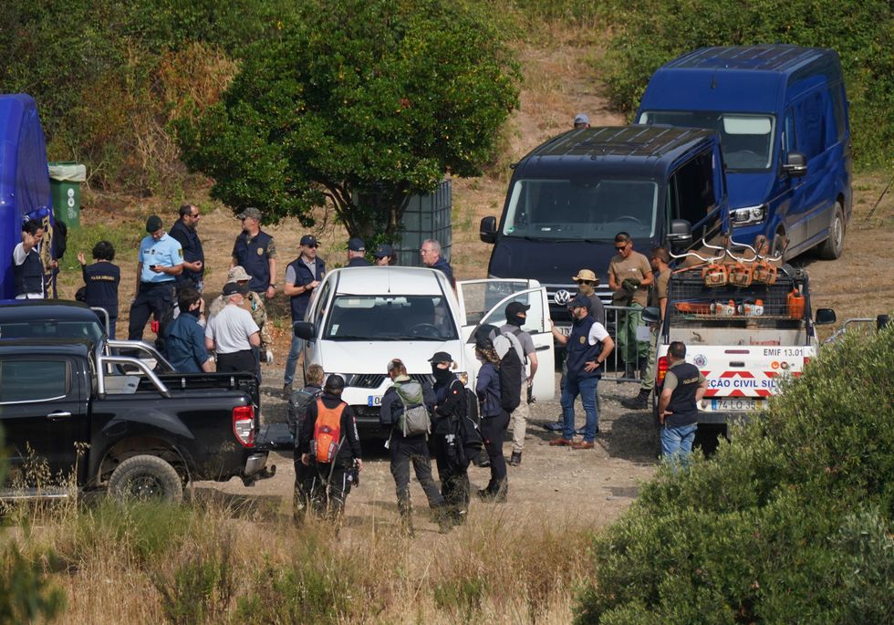 Police near a reservoir in search for Madeleine McCann's pink pyjamas