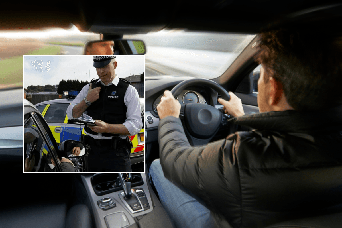 Police officer and driver in car
