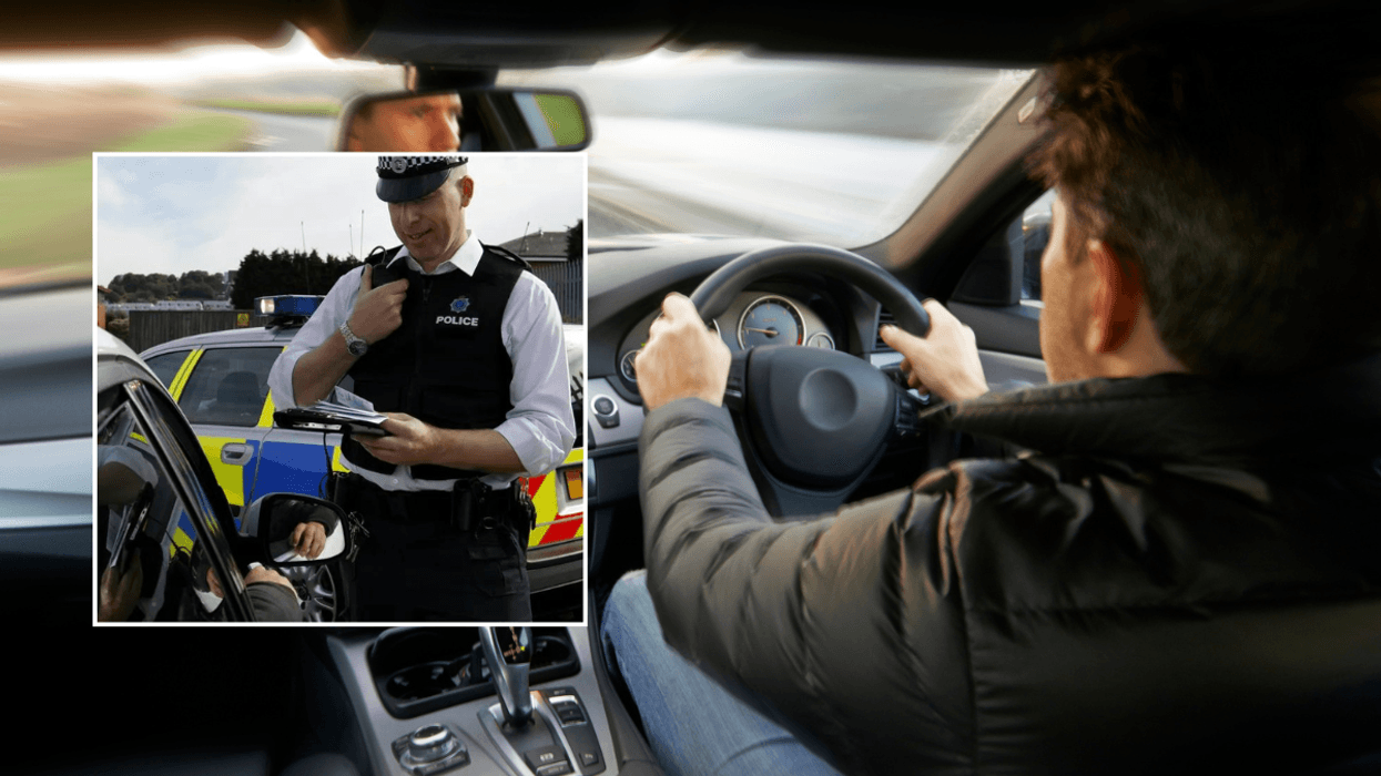 Police officer and driver in car
