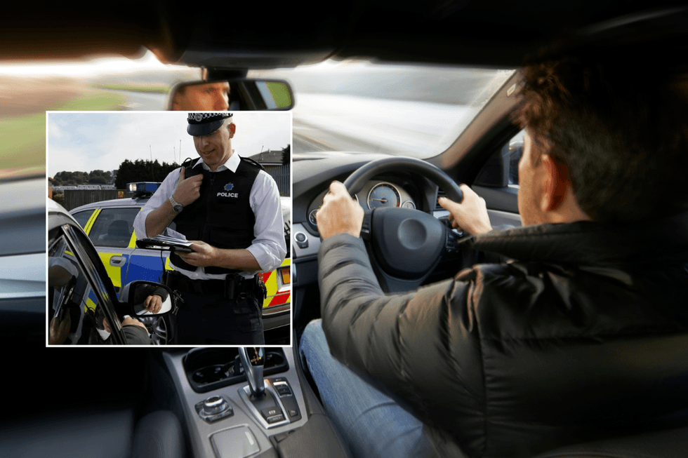 Police officer and driver in car