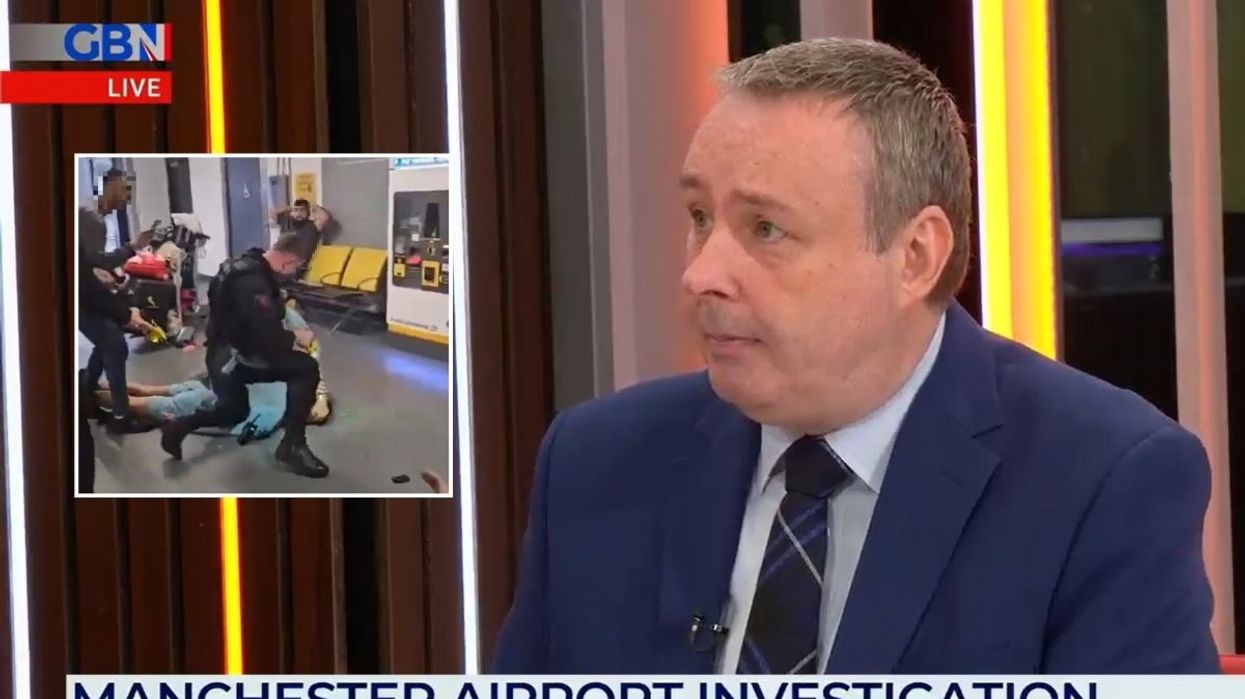 Police officer at Manchester Airport and Mark White