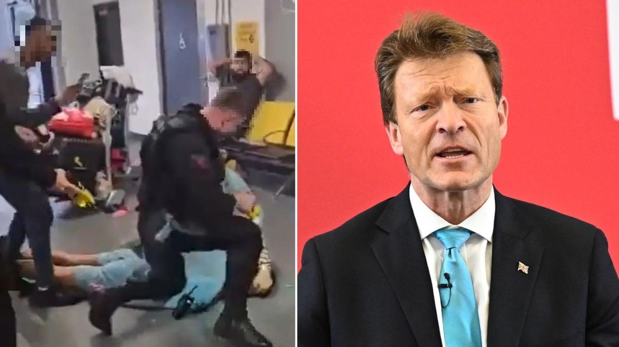 Police officer at Manchester Airport and Richard Tice