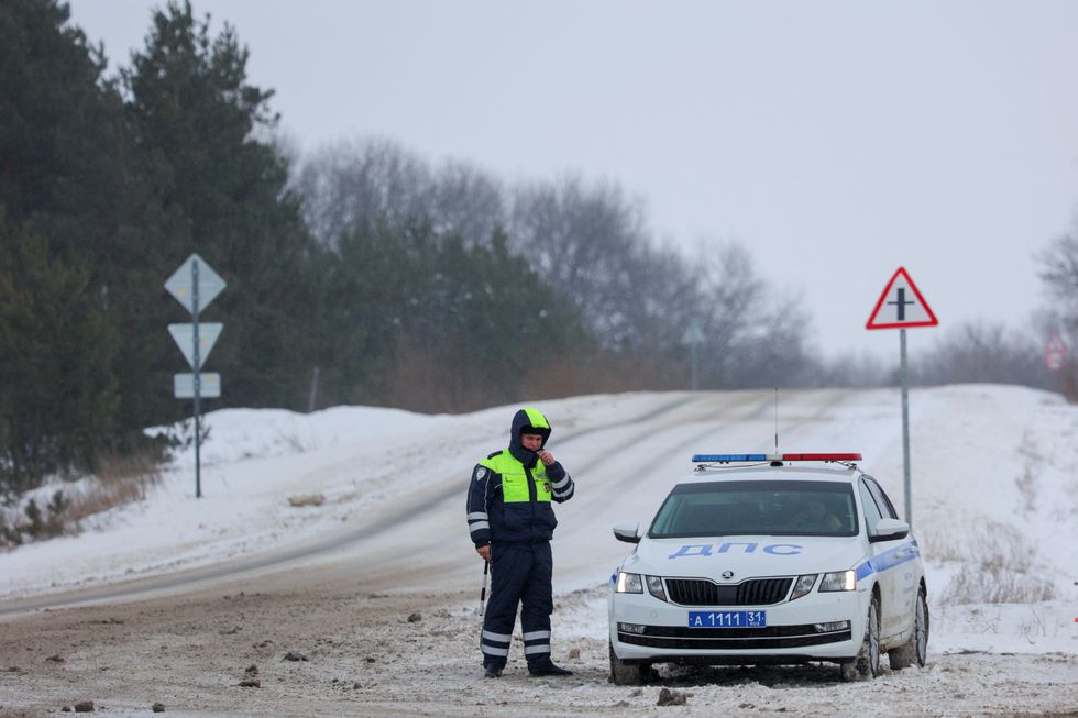 Police officer checking a road