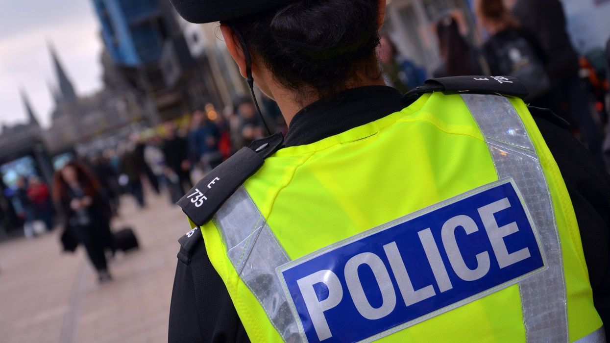 Police officer in Scotland walks on a street