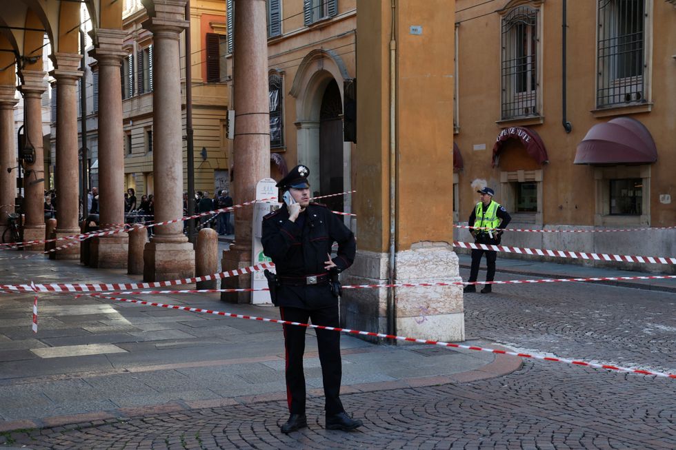 Police officer outside the scene in Modena