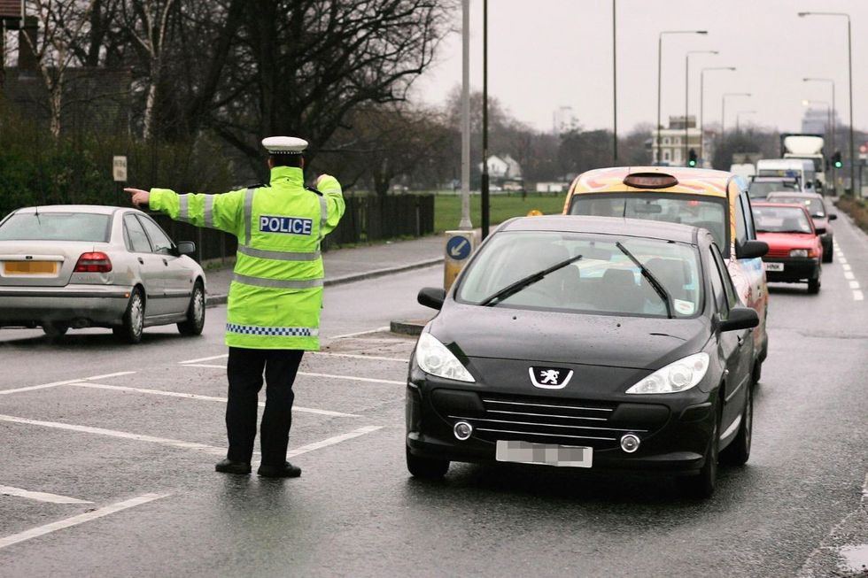 Police officer pulling a car over