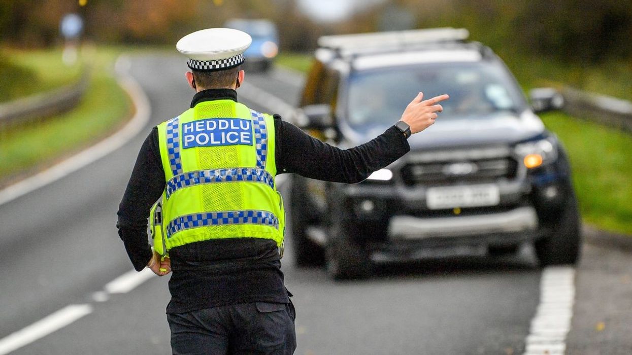 Police officer pulling a car over