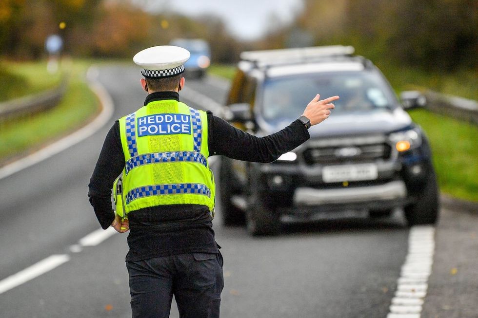 Police officer pulling a car over