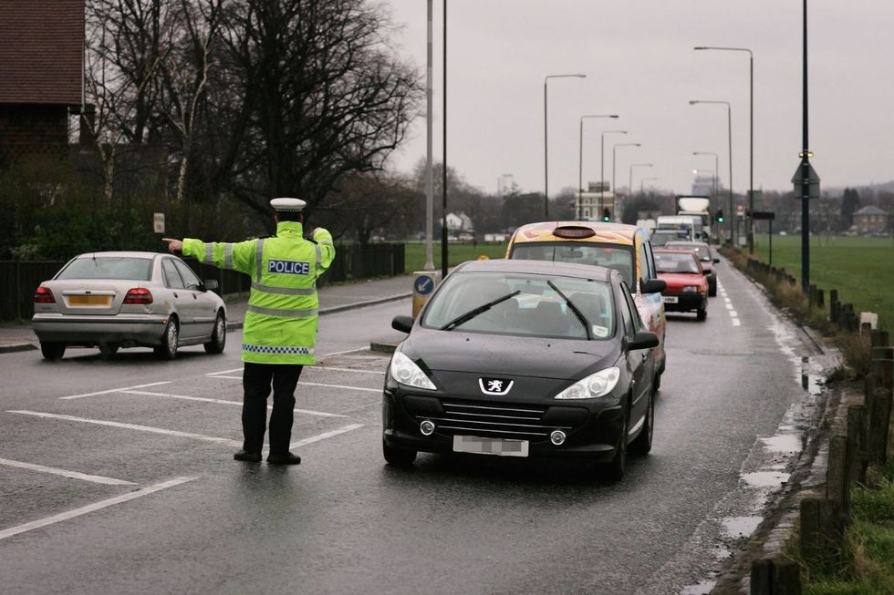 Police officer pulling a car over