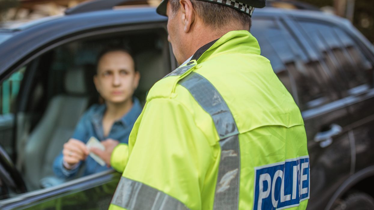 Police officer pulling car over