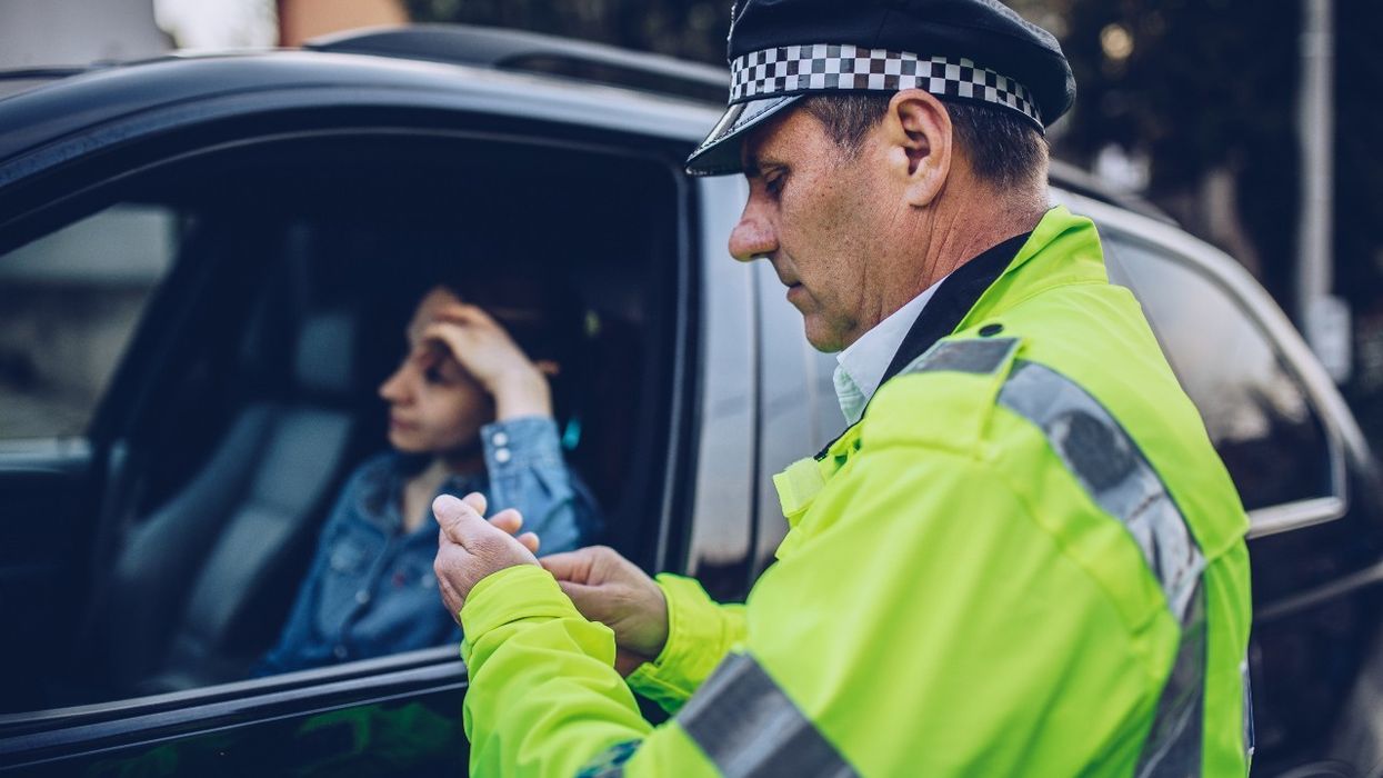 Police officer pulling over a driver for speeding