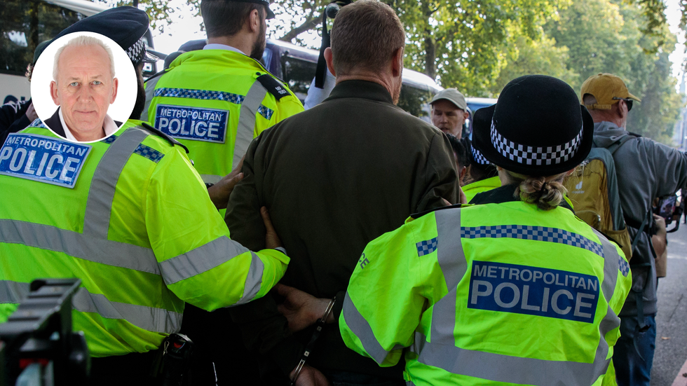 Police officers arrest someone