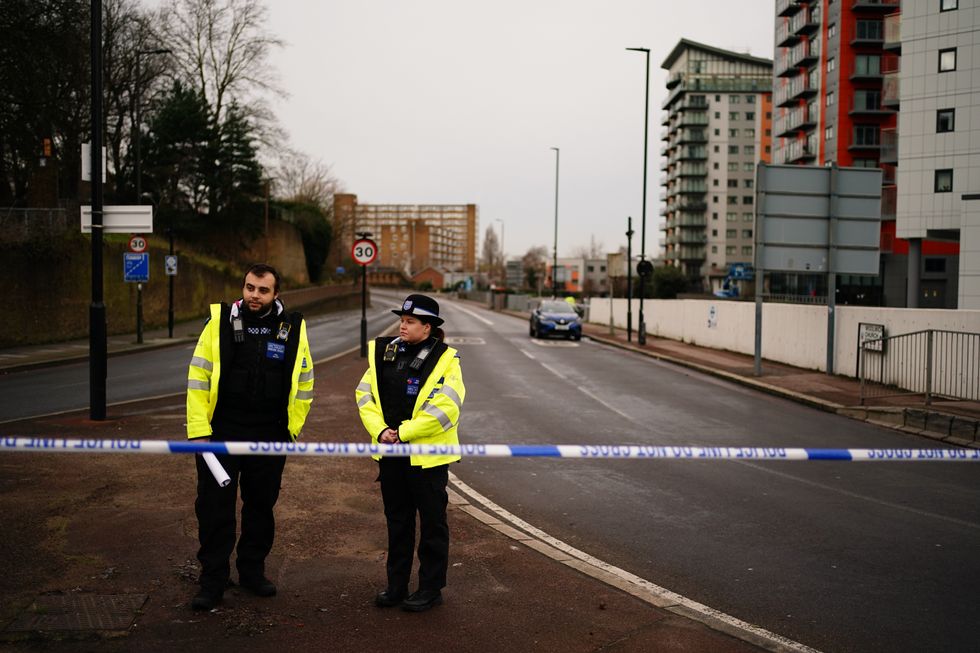 Police officers at the scene of the stabbing in Woolwich