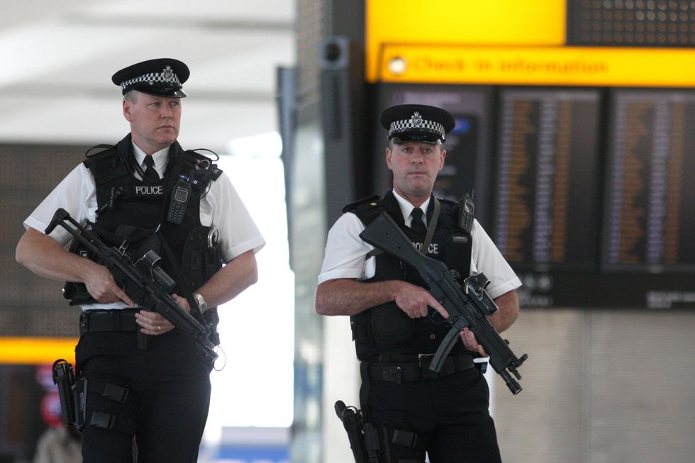 Police officers during a routine patrol in Terminal 5 of Heathrow Airport.