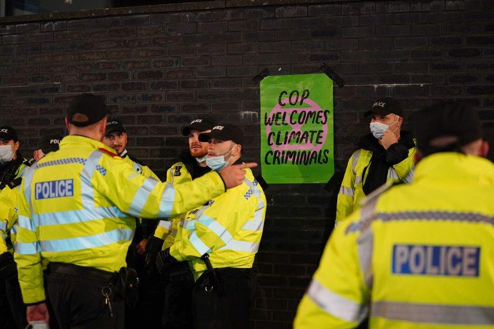Police officers during an Extinction Rebellion protest in Glasgow. Picture date: Wednesday November 3, 2021.