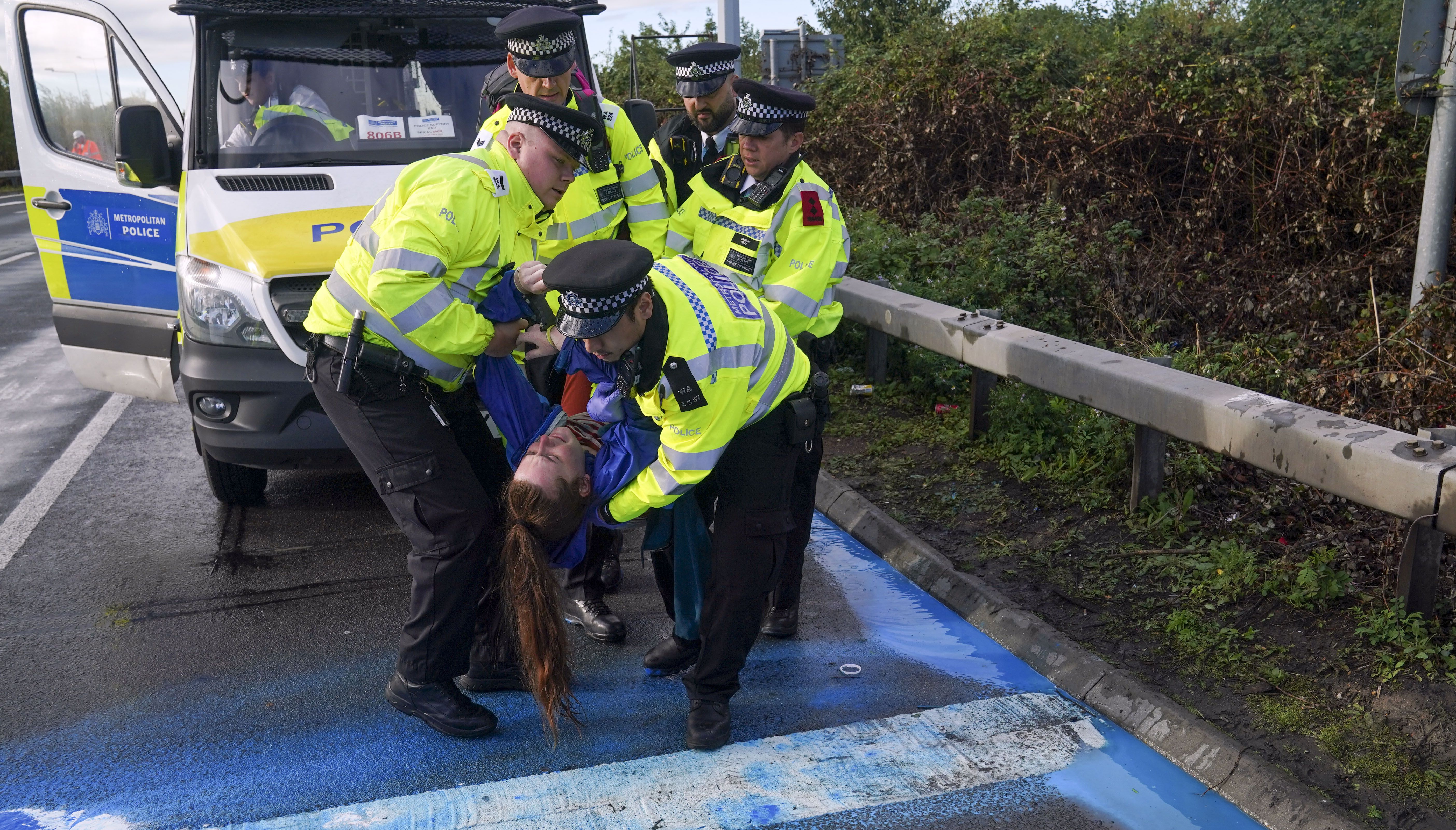 Police officers had to carry some Insulate Britain protesters away from the roads leading to Heathrow Airport.