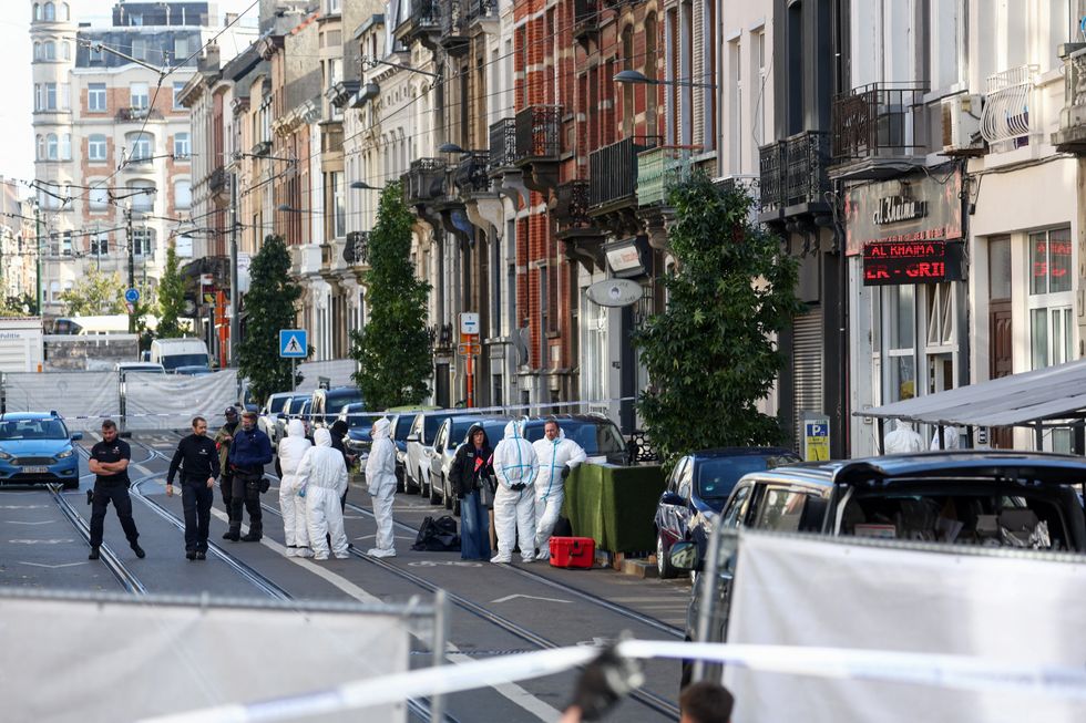 Police officers investigate fatal shooting in Brussels