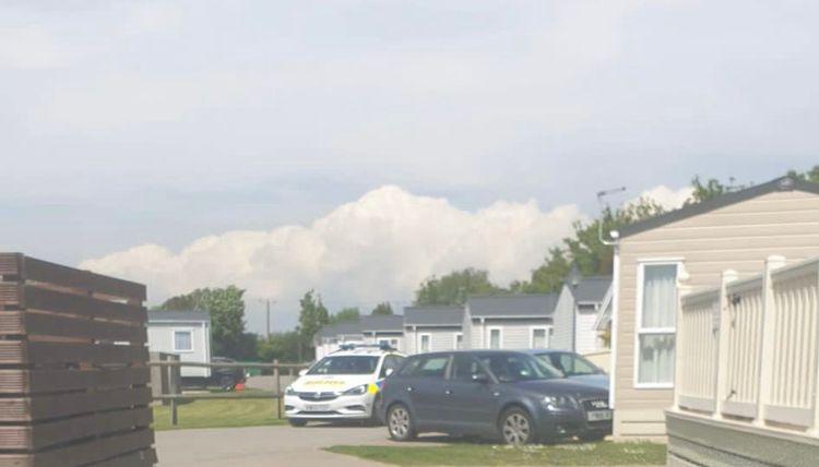 Police Officers investigating the migrants searching a campsite
