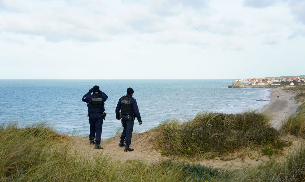 Police officers on a beach