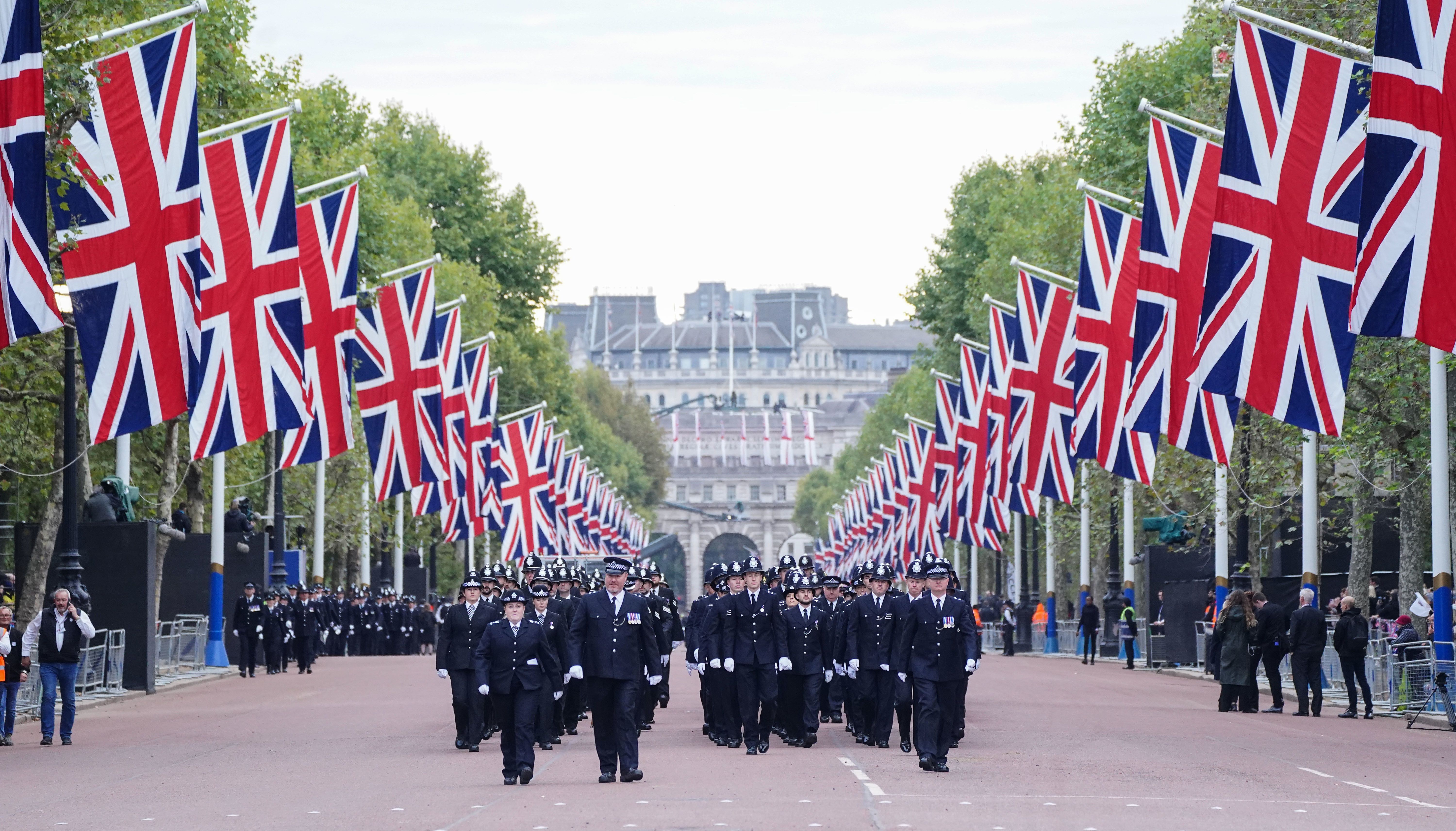 Police officers on The Mall ahead of the State Funeral of Queen Elizabeth II at Westminster Abbey, London.