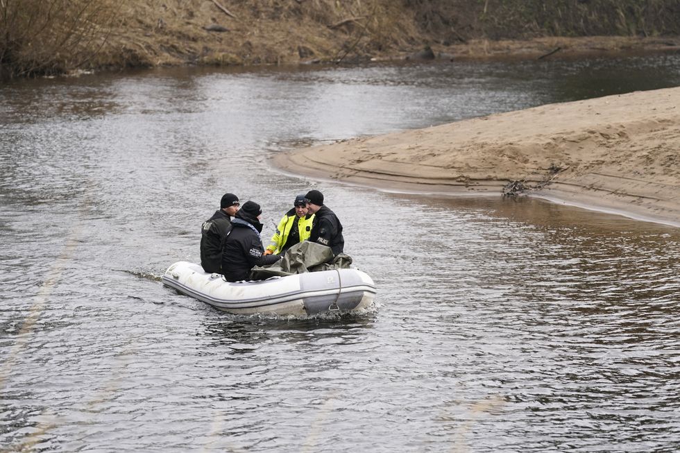 Police officers on the River Wyre, in St Michael's on Wyre, Lancashire, as police continue their search for missing woman Nicola Bulley, 45, who was last seen on the morning of Friday January 27, when she was spotted walking her dog on a footpath by the nearby River Wyre. Picture date: Friday February 3, 2023.