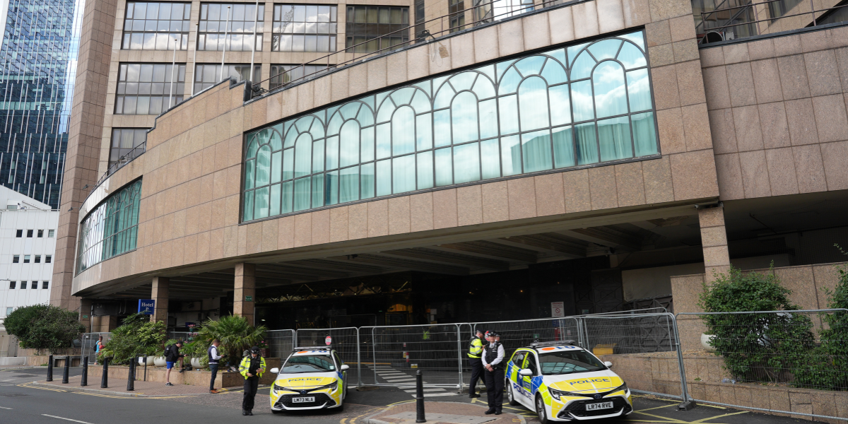 NextImg:Police officer punched in the face at London asylum hotel protest as three arrests made