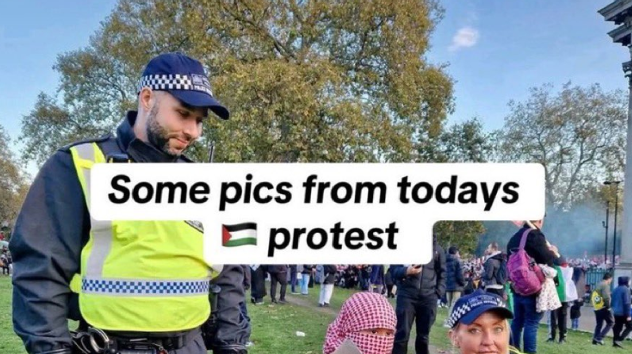Police officers posing with the child