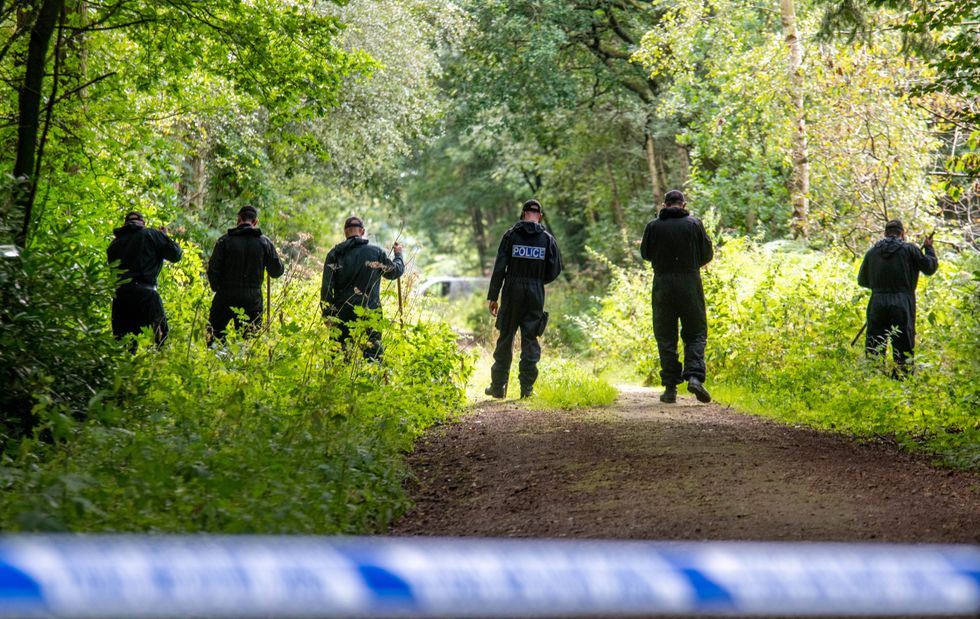 Police officers searching the land at Sand Hutton Gravel Pits near York in connection with the disappearance of missing university chef Claudia Lawrence.
