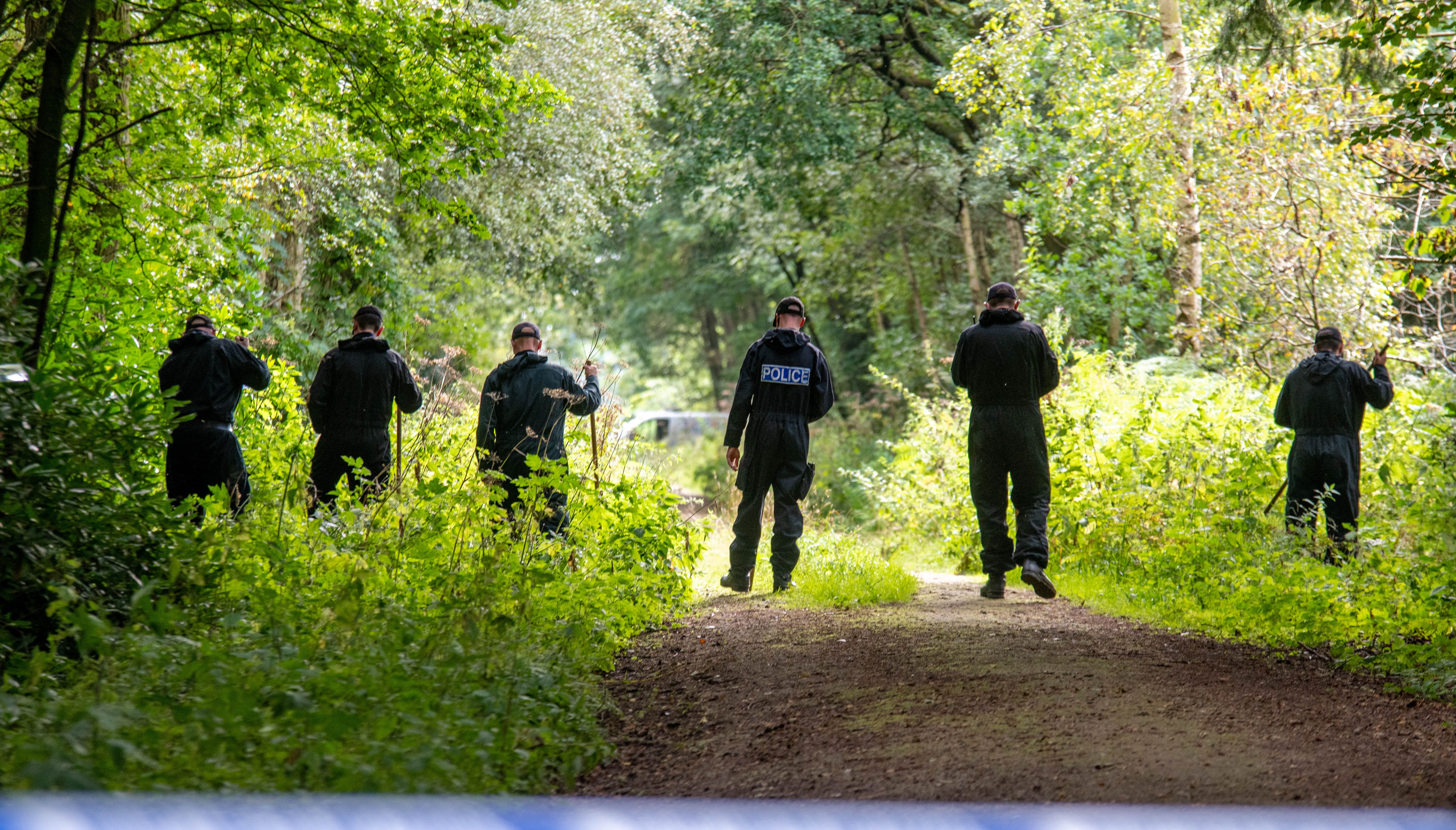 Police officers searching the land at Sand Hutton Gravel Pits near York