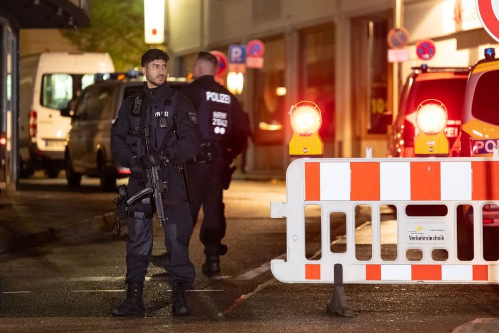 Police officers secure access to the crime scene after the Solingen city festival on August 24, 2024