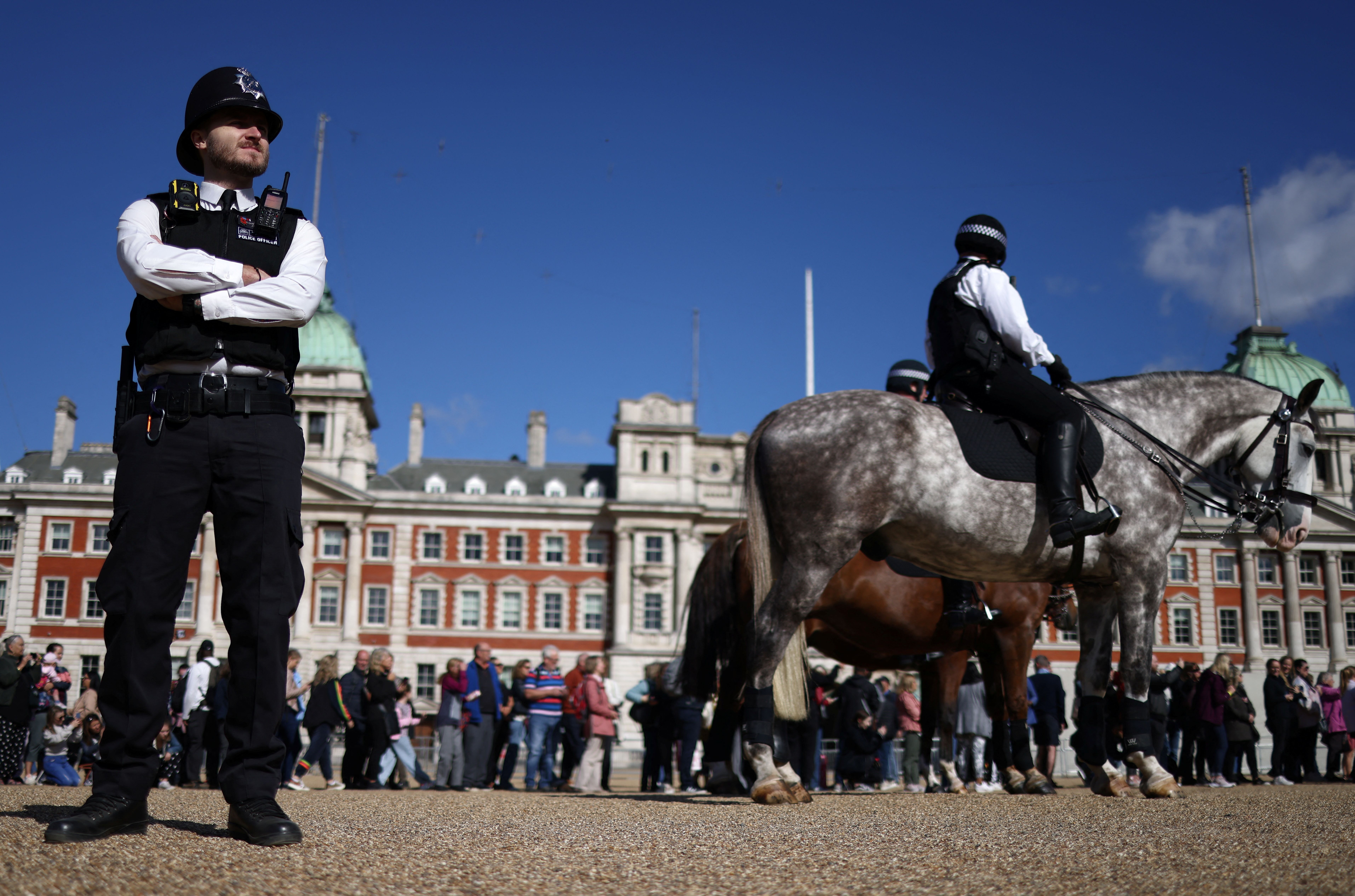 Police officers stand guard at the changing of the guard ceremony at the Horse Guards Parade, following the death of Britain's Queen Elizabeth, in London, Britain September 16, 2022. REUTERS/Tom Nicholson