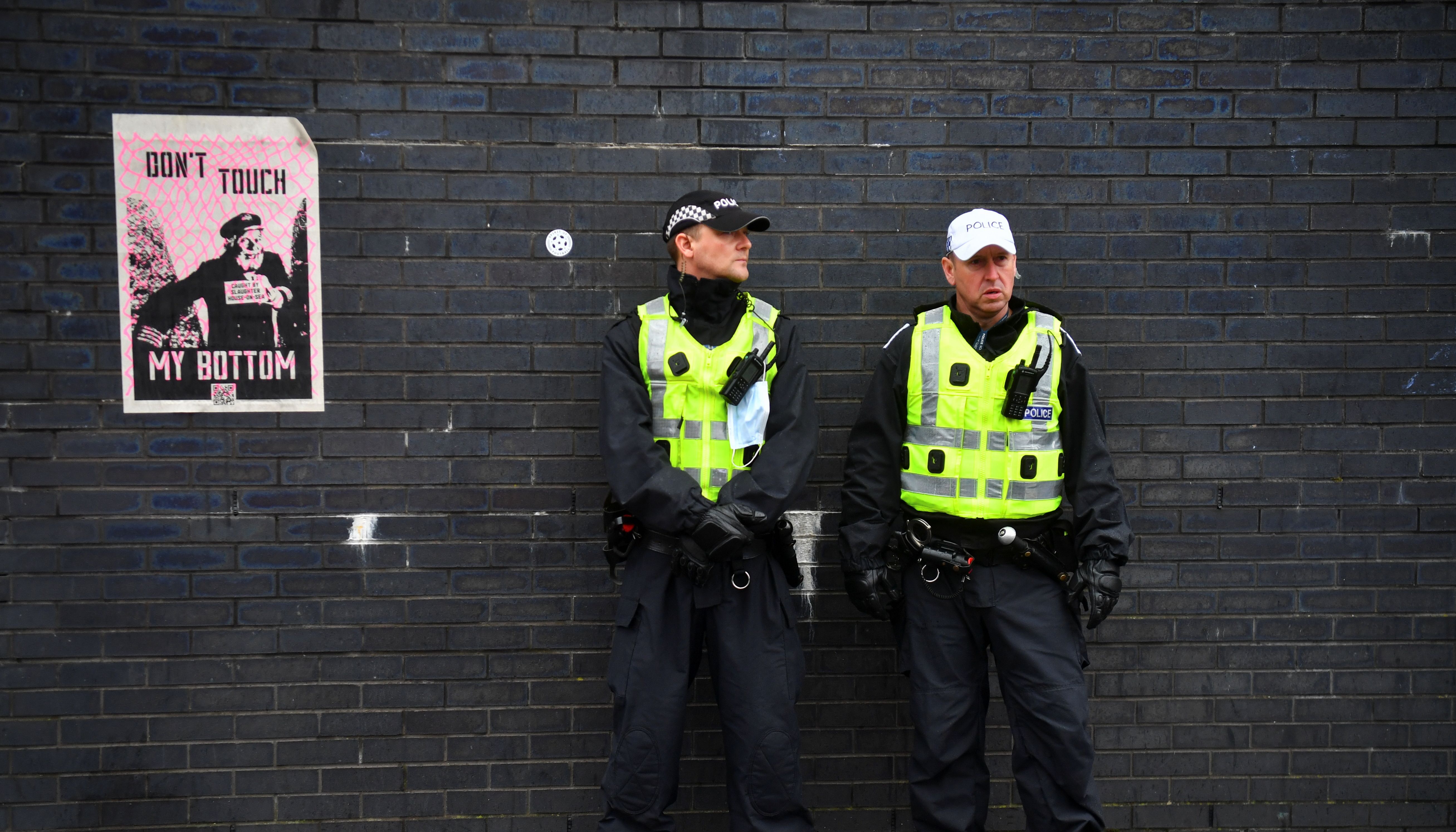 Police officers stand guard outside the UN Climate Change Conference (COP26) venue, in Glasgow, Scotland