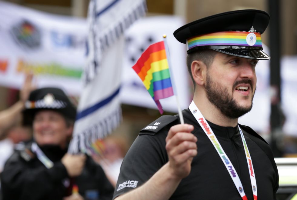 Police officers take part in the Pride Glasgow parade through the city centre.