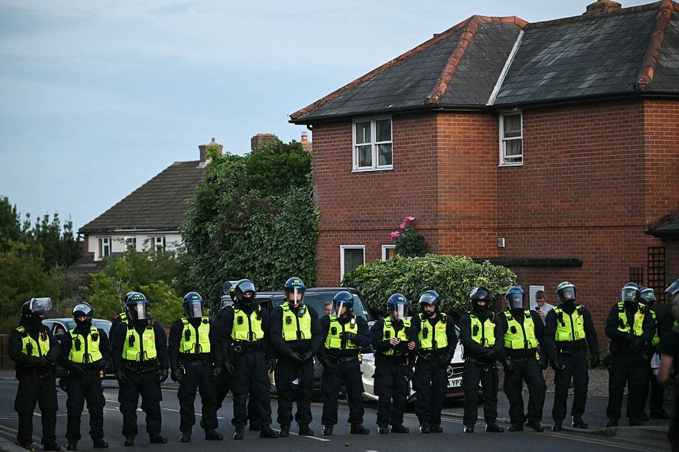 Police outside asylum hotel in Essex