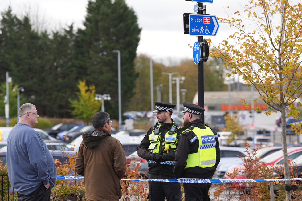 Police outside Huntingdon station in the aftermath of the brutal stabbing