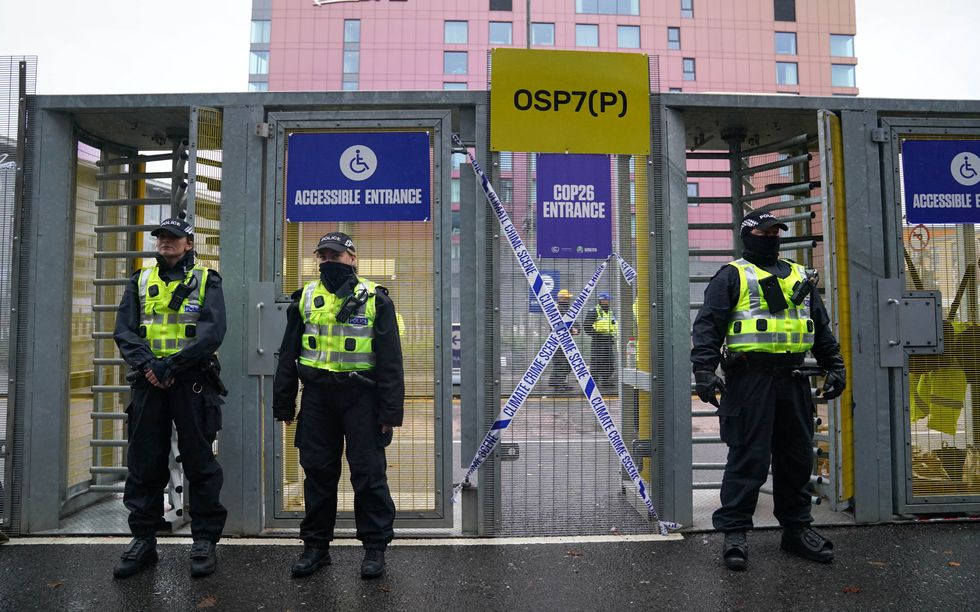 Police outside one the gates during the official final day of the Cop26 summit in Glasgow.