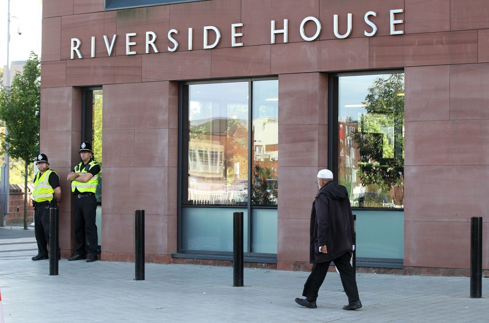 Police outside Rotherham council offices following the publication of a report that found around 1,400 children were sexually exploited in the town over a 16-year period.