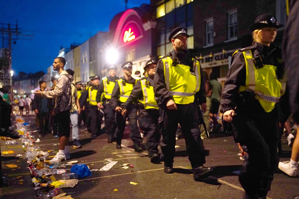 Police patrol during the family day at the Notting Hill Carnival in London, which returned to the streets for the first time two years after it was thwarted by the pandemic. Picture date: Sunday August 28, 2022.
