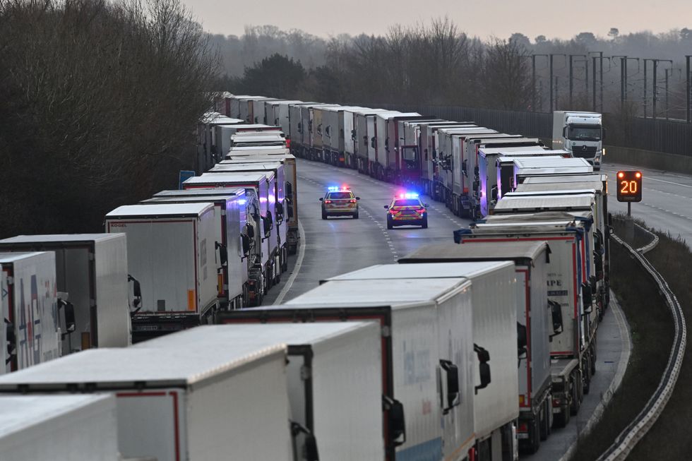 Police patrol rows of lorries queueing for Dover border crossing