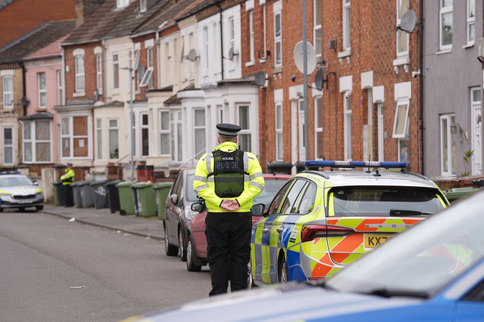 Police presence outside a house in Wellingborough's Newcomen Road that was damaged by fire