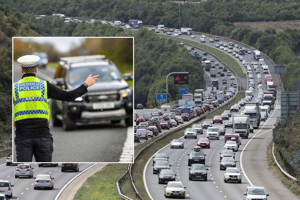 Police pulling a car over and a busy motorway