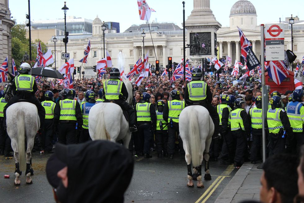 Police push back protesters taking part in the Tommy Robinson-led Unite the Kingdom march \u200b