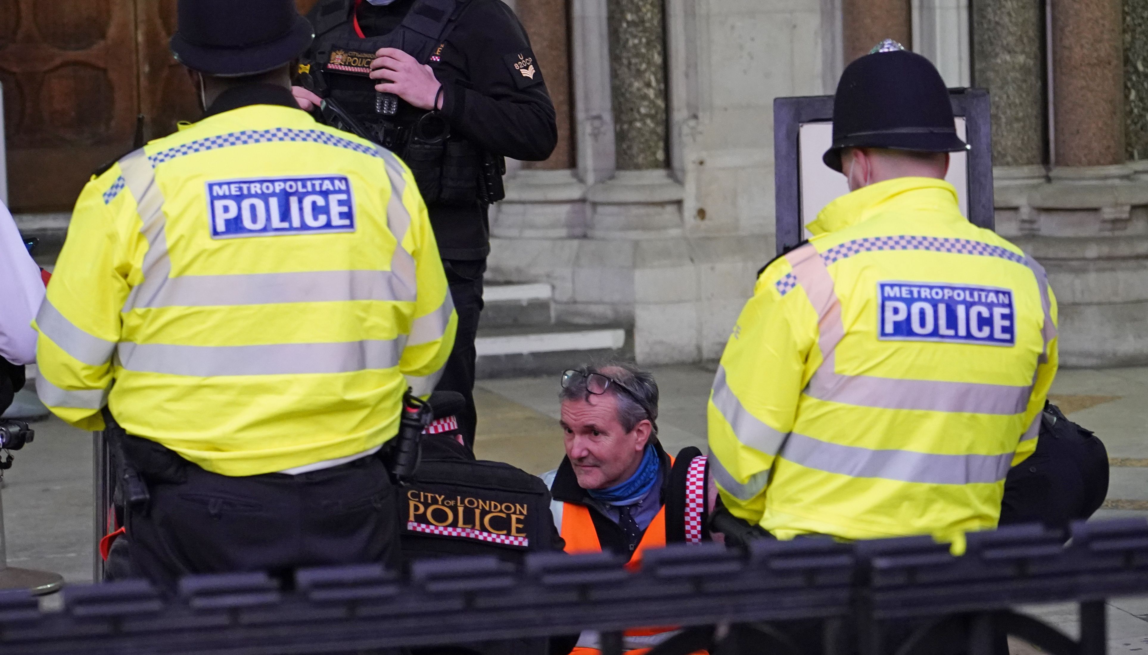 Police remove glue from Insulate Britain defendant Steve Pritchard, 62