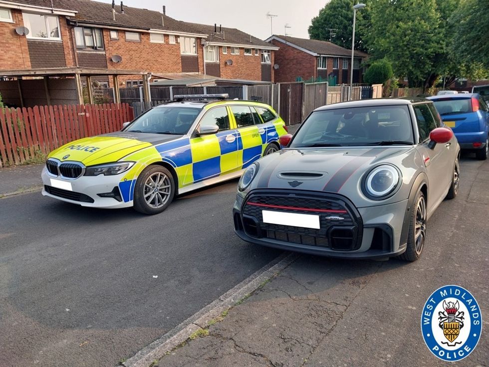 Police retrieving stolen car