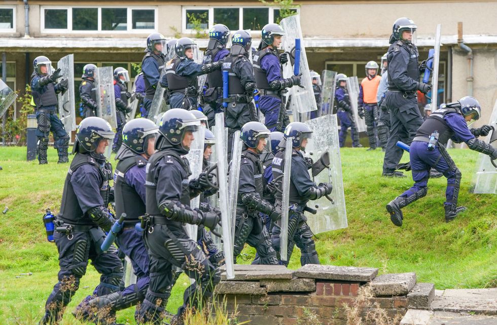 Police Scotland officers take part in a role-play exercise recreating a protest during COP26 public order training